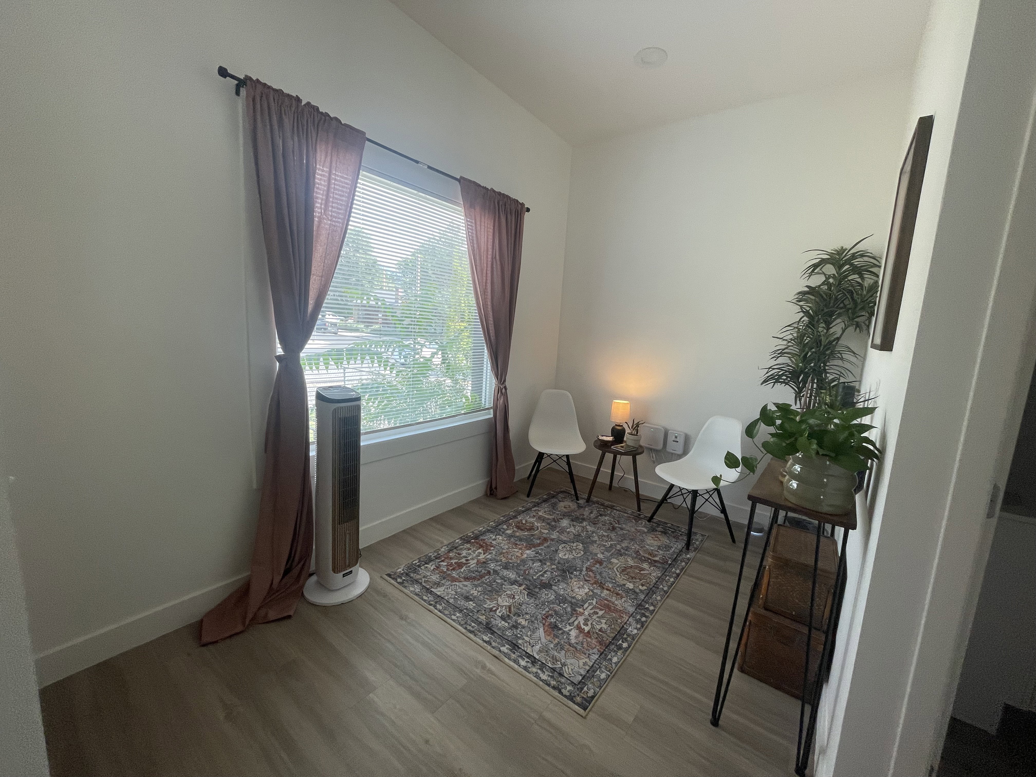 Sitting room featuring light wood-style floors and baseboards