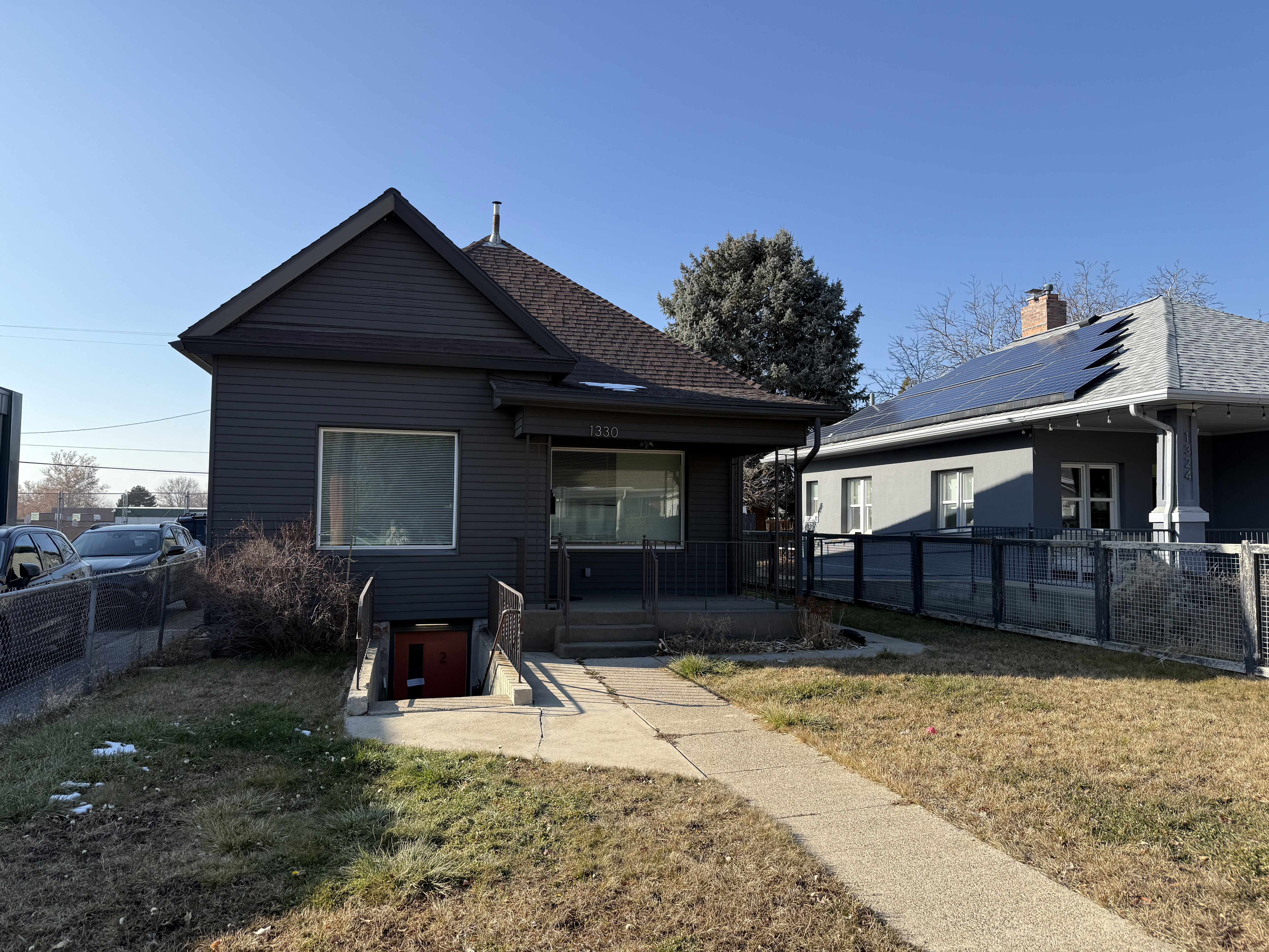 Rear view of house featuring covered porch
