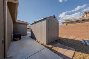 View of shed featuring a fenced backyard