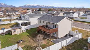 Aerial perspective of suburban area with a mountainous background