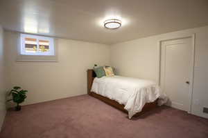 Bedroom in basement with new double pane windows and large closet