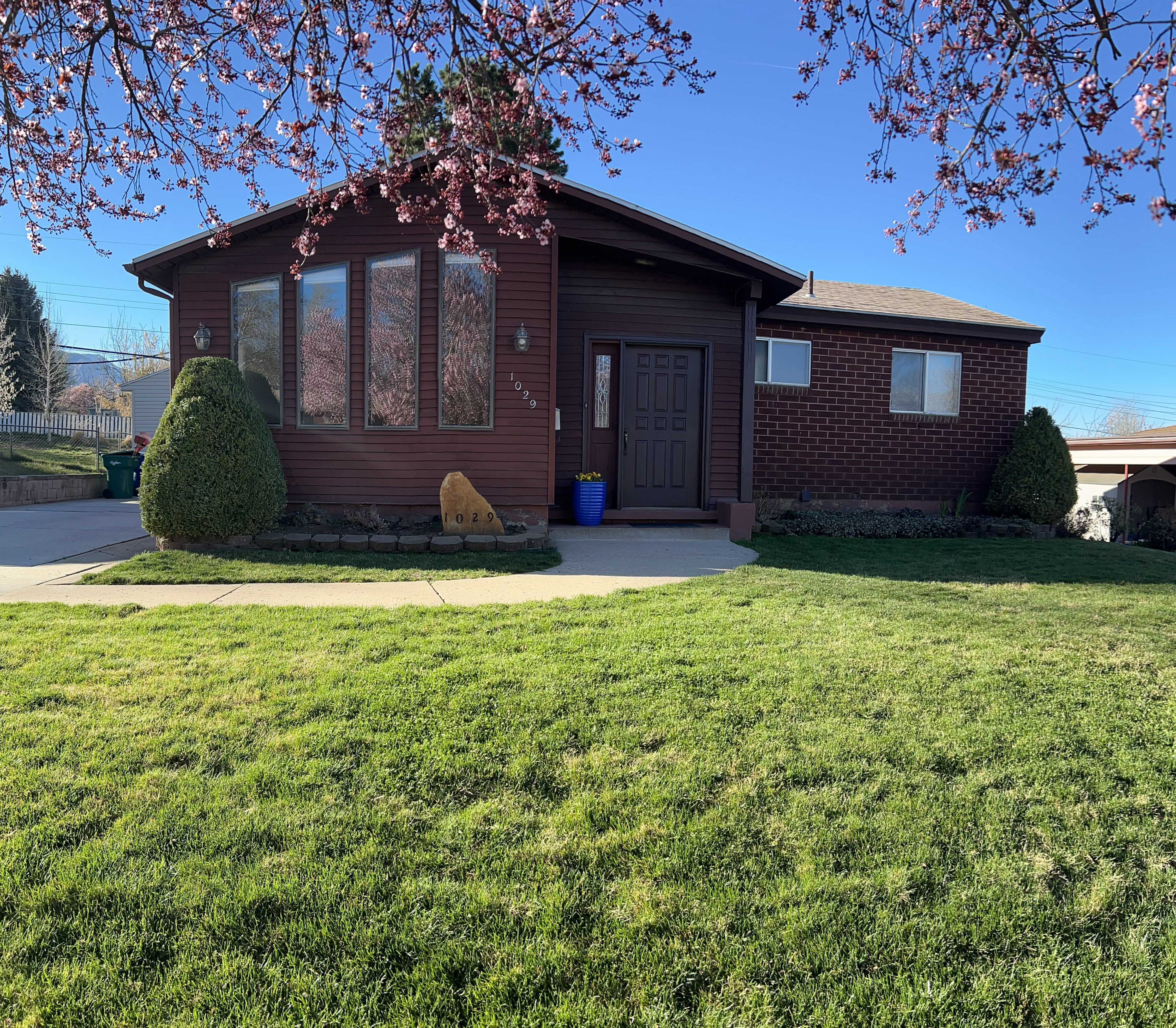 View of front of property with a front lawn