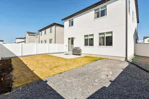 Back of house featuring a patio, a fenced backyard, and stucco siding