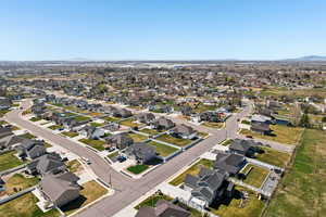 Aerial perspective of suburban area with a mountainous background