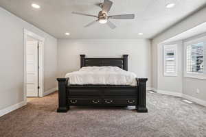Bedroom featuring carpet flooring, a ceiling fan, recessed lighting, and a textured ceiling