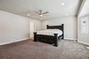 Bedroom with recessed lighting, a ceiling fan, carpet flooring, and a textured ceiling