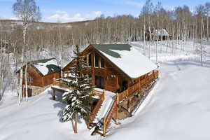 View of property exterior featuring a porch