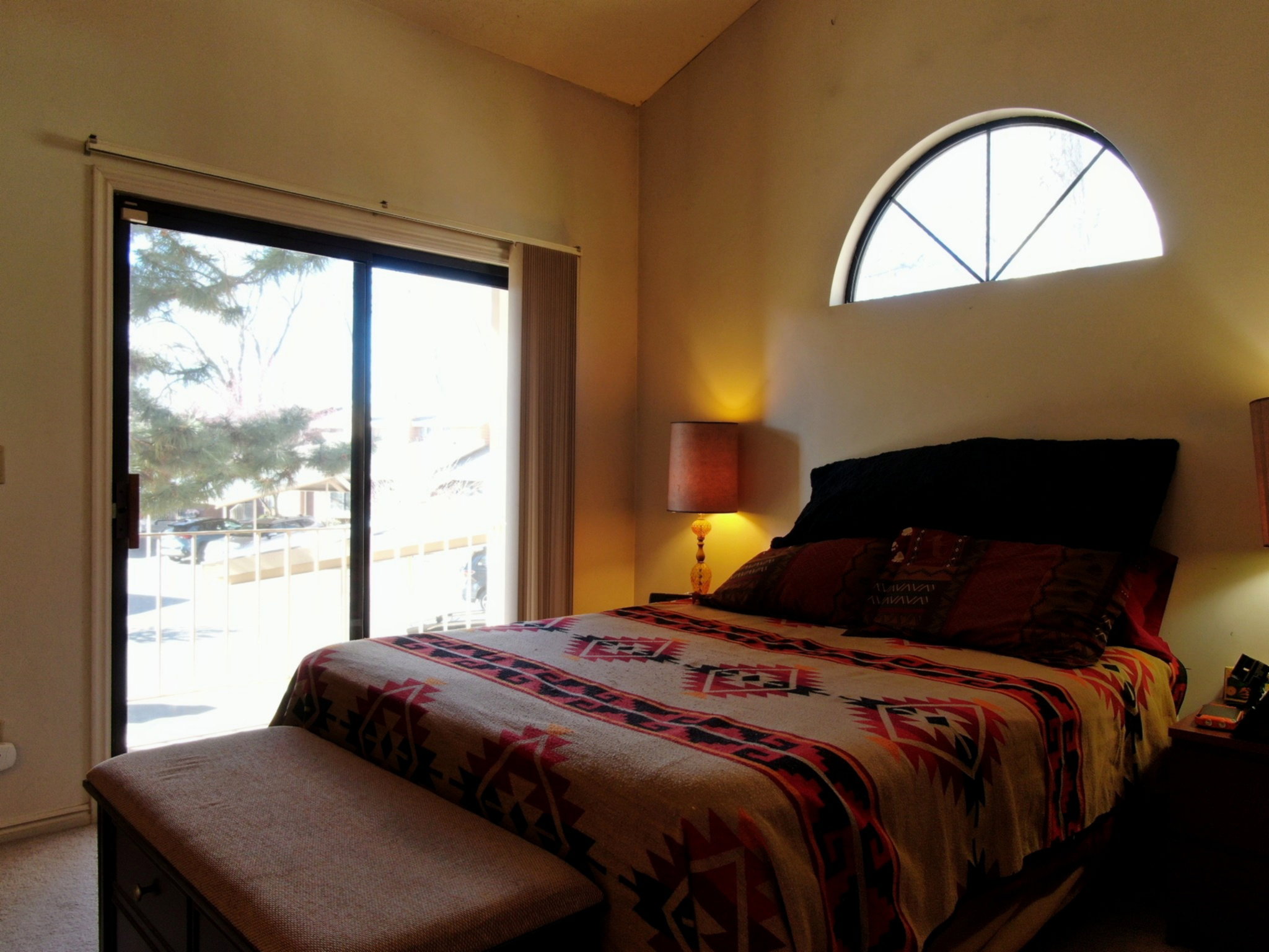 Carpeted bedroom featuring access to outside
