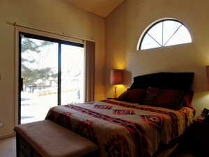 Carpeted bedroom featuring access to outside