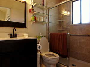 Bathroom with a stall shower and vanity