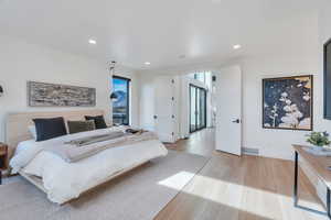 Bedroom featuring light wood-type flooring and recessed lighting