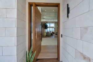 Property entrance featuring concrete block siding