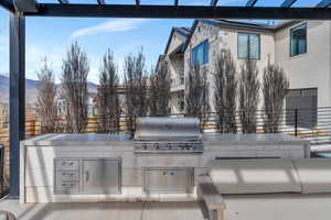 View of patio featuring area for grilling