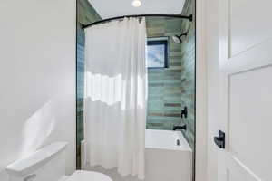 Full bathroom featuring shower / tub combo