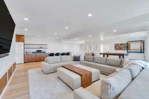 Living room featuring light wood-type flooring and recessed lighting