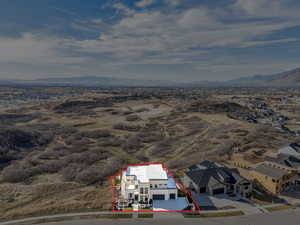 Aerial overview of property's location with mountains and property parcel outlined