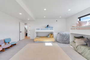 Bedroom featuring light colored carpet, recessed lighting, and wallpapered walls