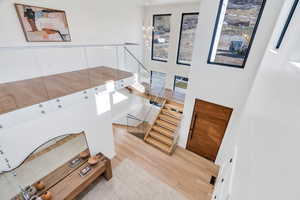 Staircase featuring wood finished floors