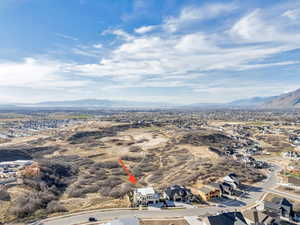 Aerial perspective of suburban area featuring a mountainous background