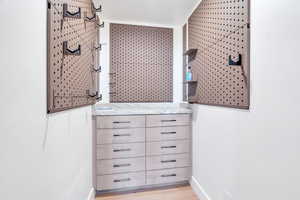 Half bath featuring vanity and light wood-style flooring