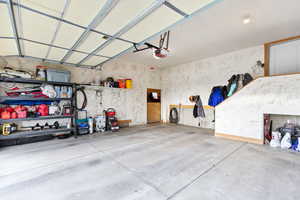 Garage featuring a garage door opener