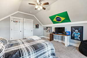Bedroom featuring light carpet and a ceiling fan