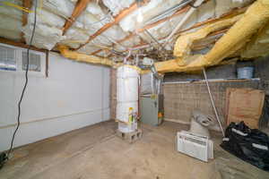 Unfinished basement with water heater and heating unit