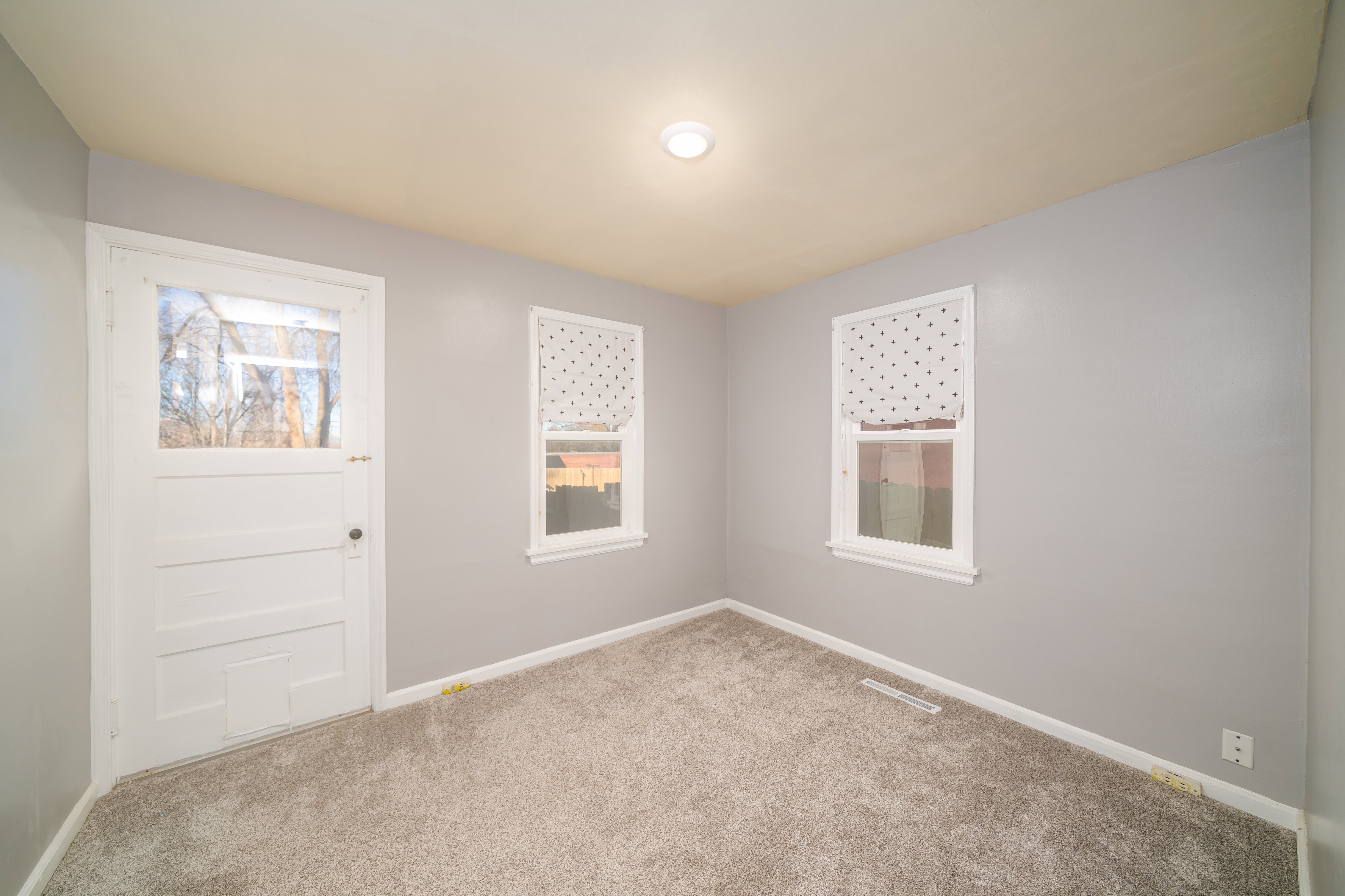 room featuring carpet flooring and baseboards
