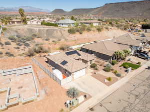 Aerial perspective of suburban area with a mountain backdrop