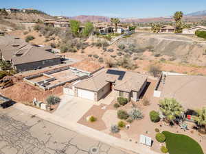 Aerial view of residential area featuring a mountainous background
