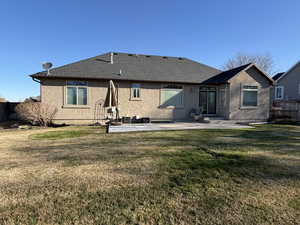 Back of house featuring a patio, stucco siding, and roof with shingles, large patio