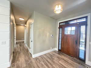 Entry and hall way to main floor 3 bedrooms and hallway full bath