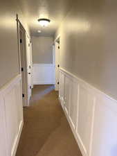 Hallway to Bedroom 4 & 5, Exercise/Toyroom and storage plus hall full bath