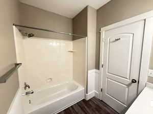 Full Main floor hall bath featuring custom vanity, quartz countertops, tub/shower
