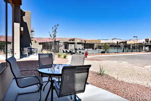 View of patio / terrace with outdoor dining space and a residential view