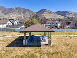 View of yard featuring a patio area, a mountain view, and a residential view