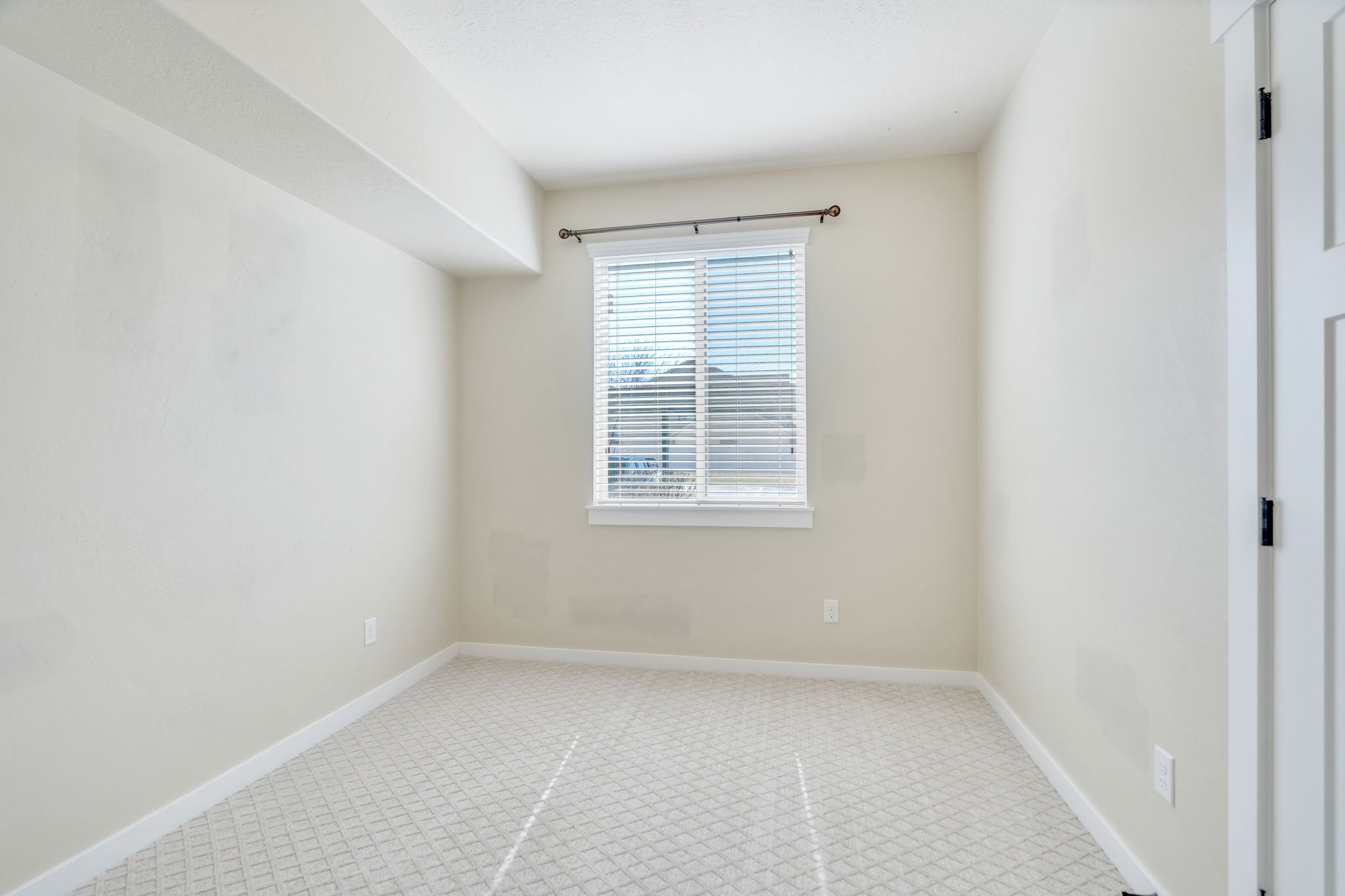 Spare room with light carpet