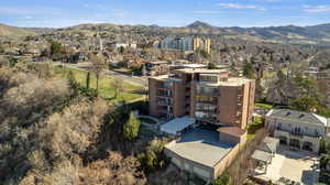 Bird's eye view of a mountain backdrop and apartment complex / building