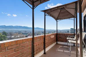 Balcony featuring a gazebo and a mountain view