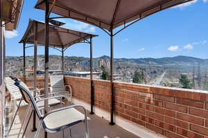 Balcony with a mountain view and a sunroom