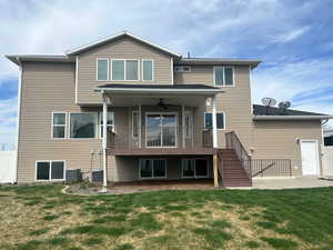 Rear view of house with a patio and a ceiling fan