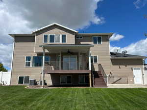 Rear view of house featuring a patio and a ceiling fan
