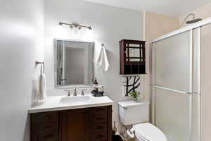 Full bath with vanity and a stall shower