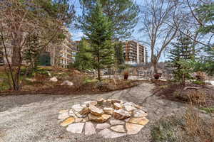 View of yard featuring a communal outdoor patio