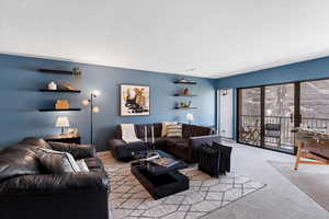 Living area featuring carpet