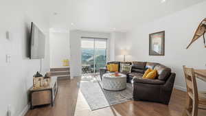 Living room with wood finished floors and recessed lighting