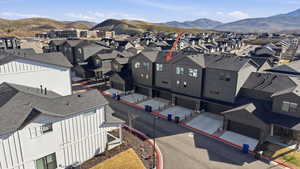 Aerial view of residential area with a mountainous background!