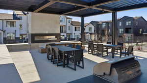 View of patio featuring outdoor dining space, a residential view, and a pergola