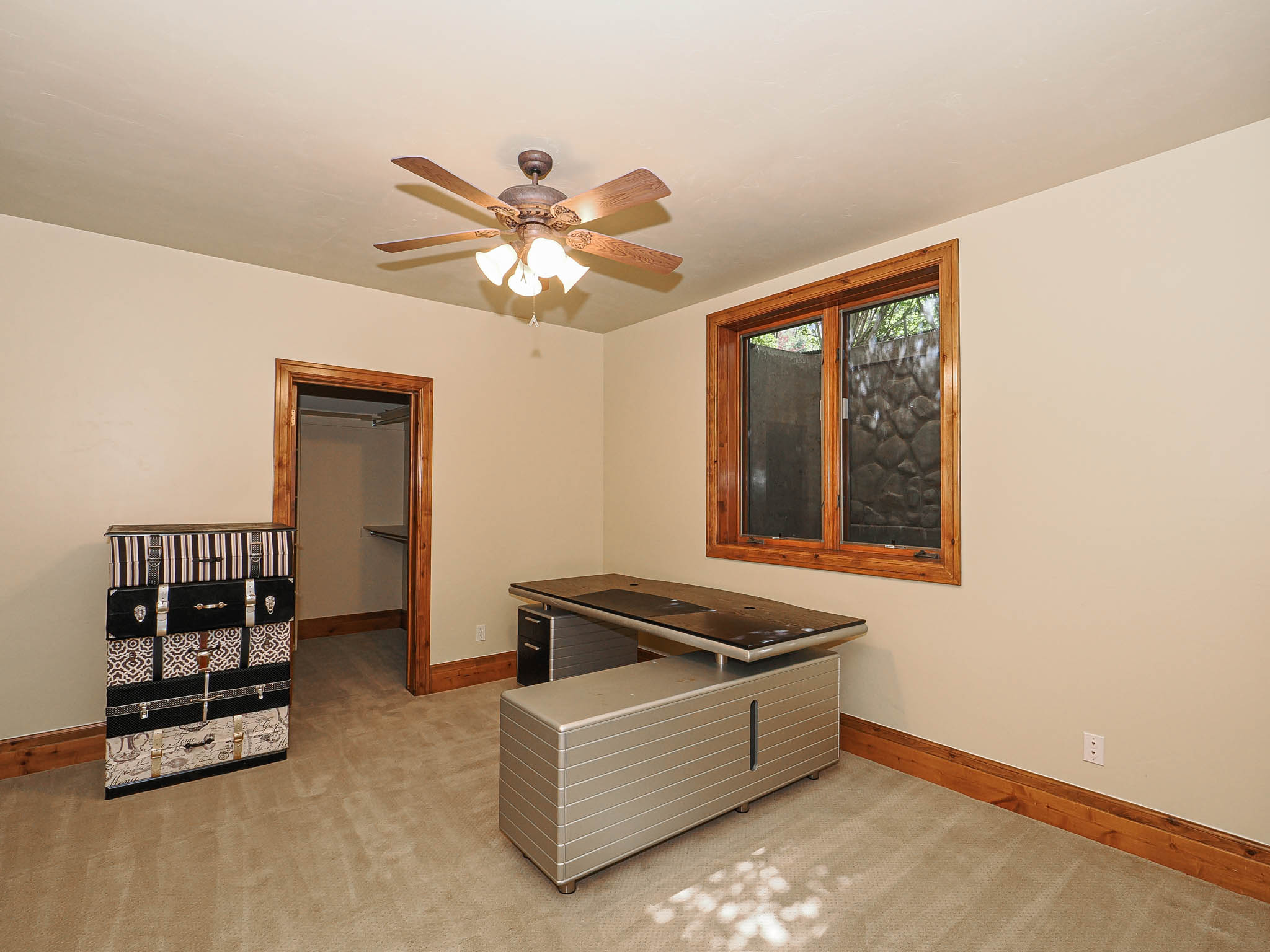 Playroom featuring light colored carpet and a ceiling fan