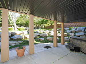 View of patio / terrace featuring a hot tub